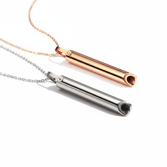 Two cylindrical necklaces, one rose gold and one silver, on a white background.