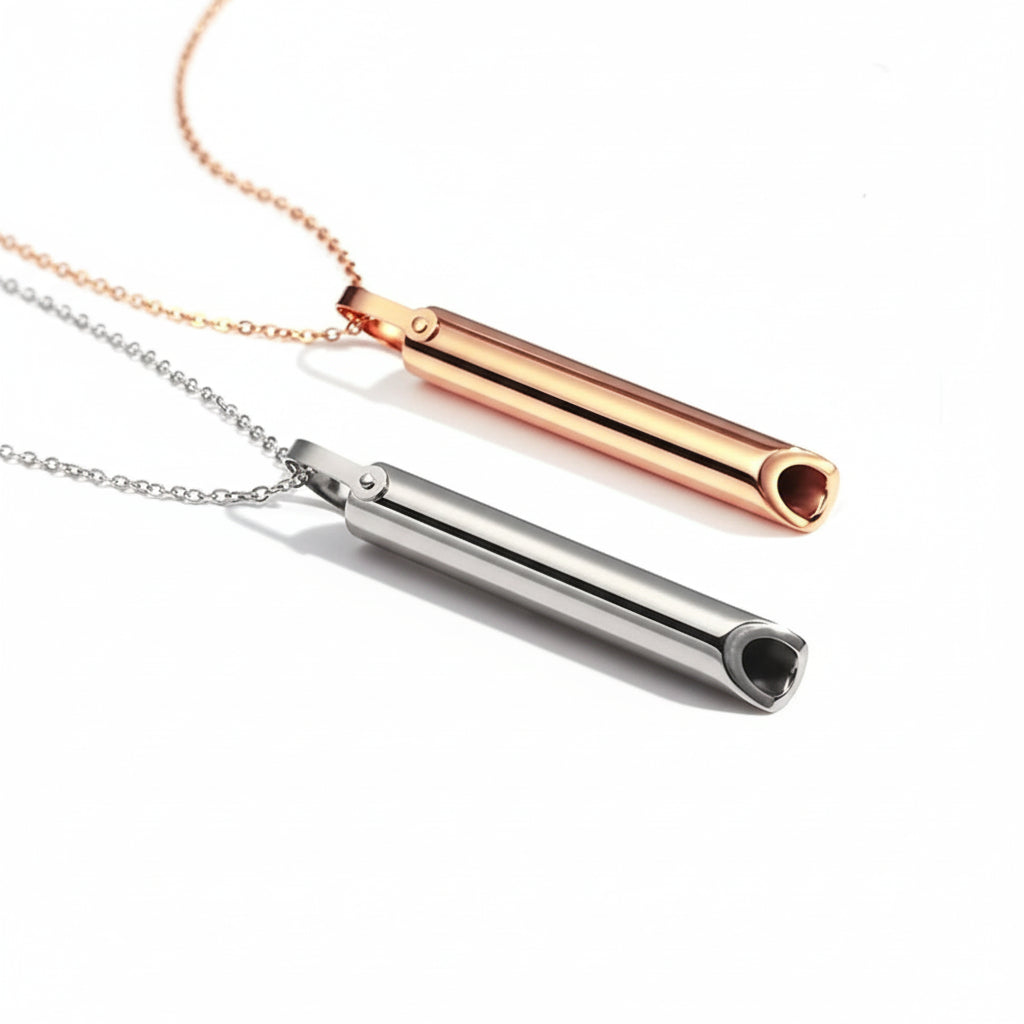 Two cylindrical necklaces, one rose gold and one silver, on a white background.