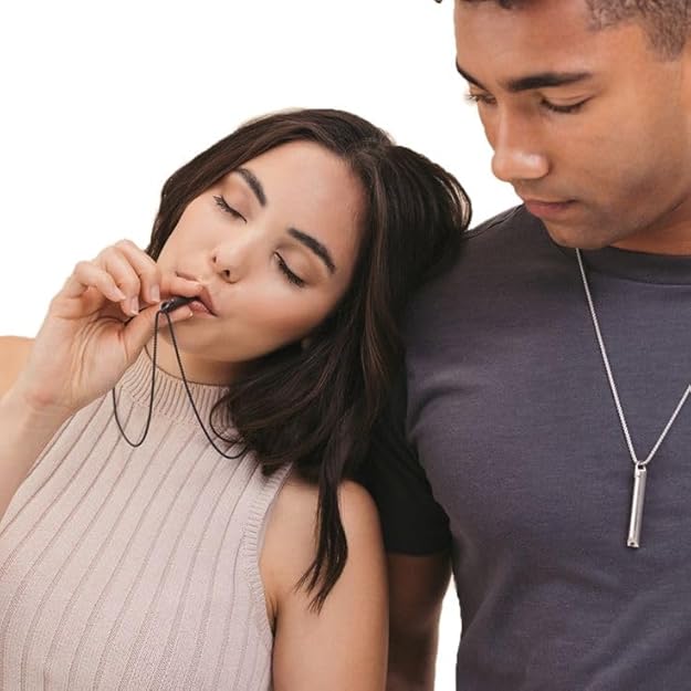 Two people wear mindflo breathing necklace